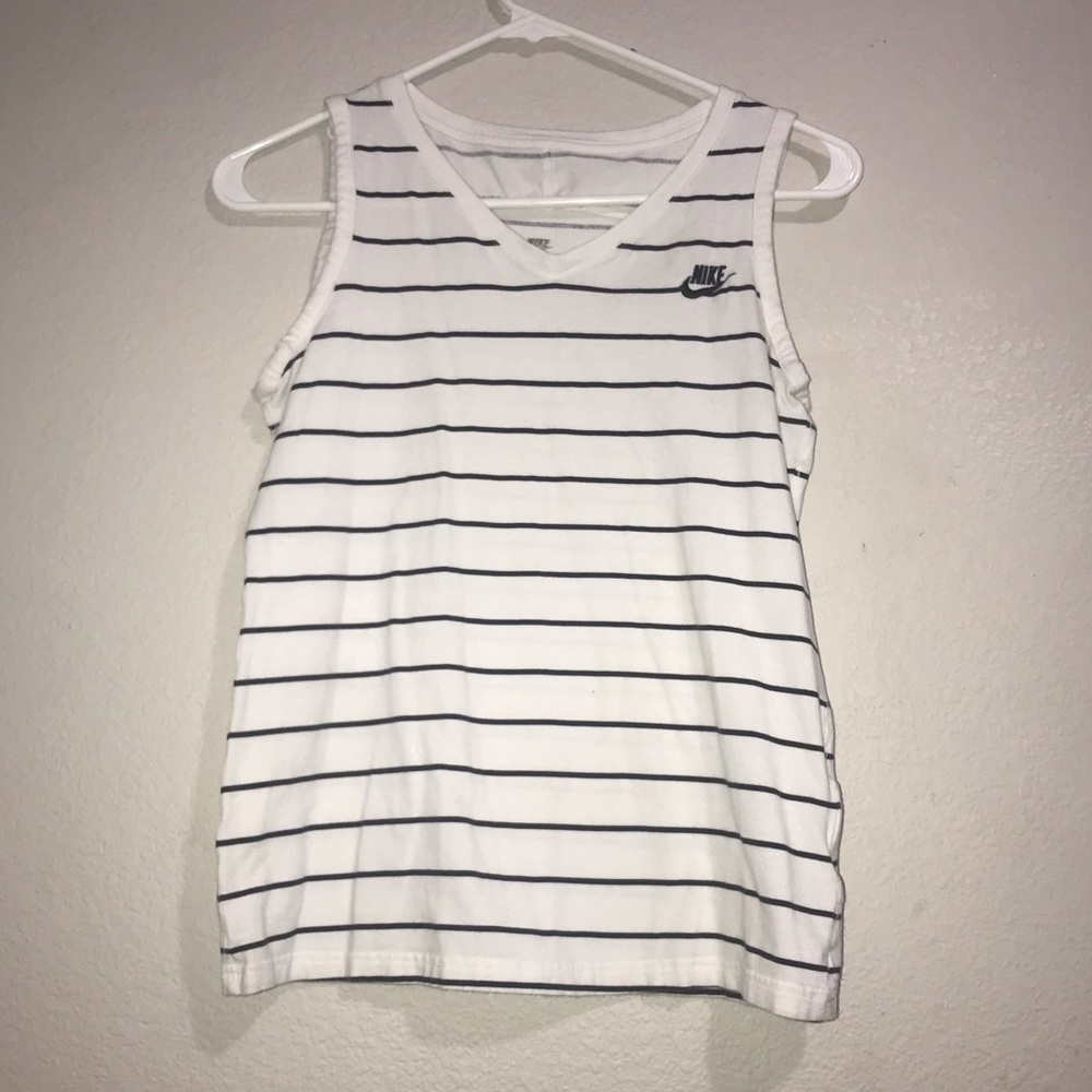 White and black woman’s Nike tank top